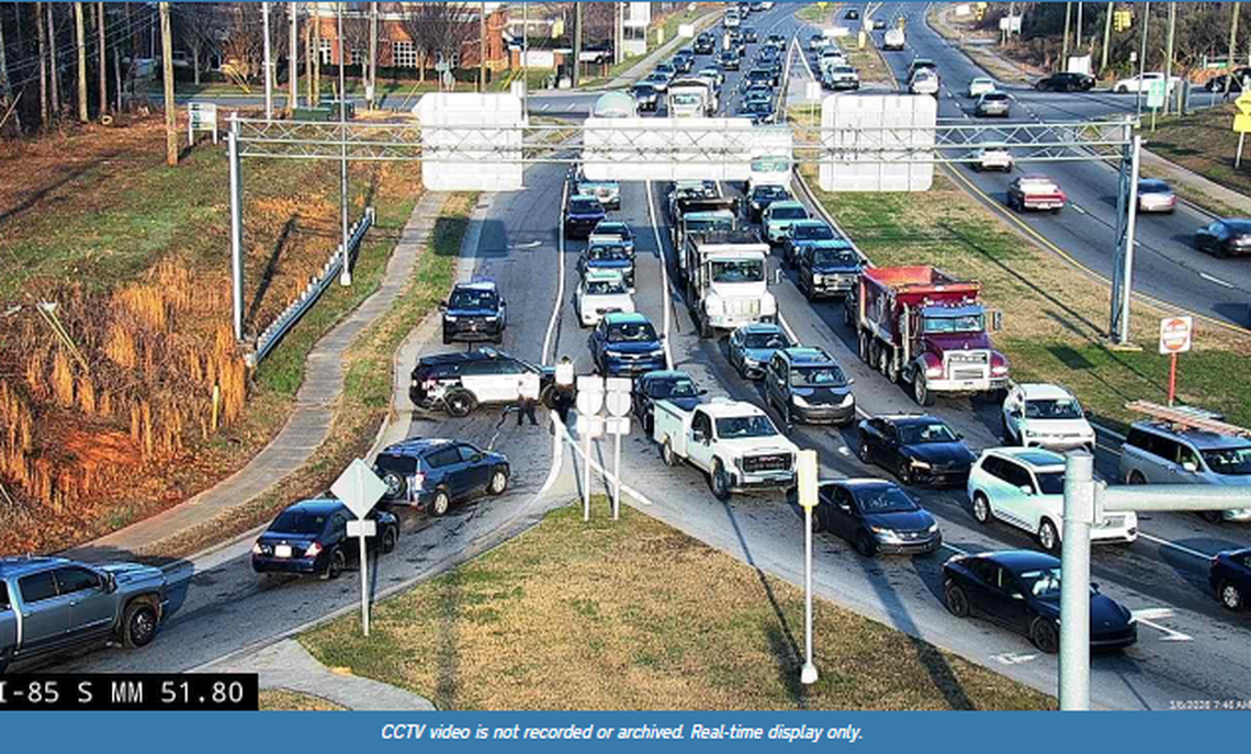 This image shows traffic exiting Interstate 85 onto Poplar Tent Road.