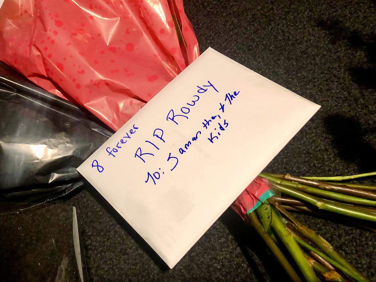 A letter addressed to Samantha Busch and her children rests on a bouquet of flowers outside Richard Childress Racing in Welcome, NC following the death of her husband NASCAR driver Kyle Busch on Thursday, May 21, 2026.