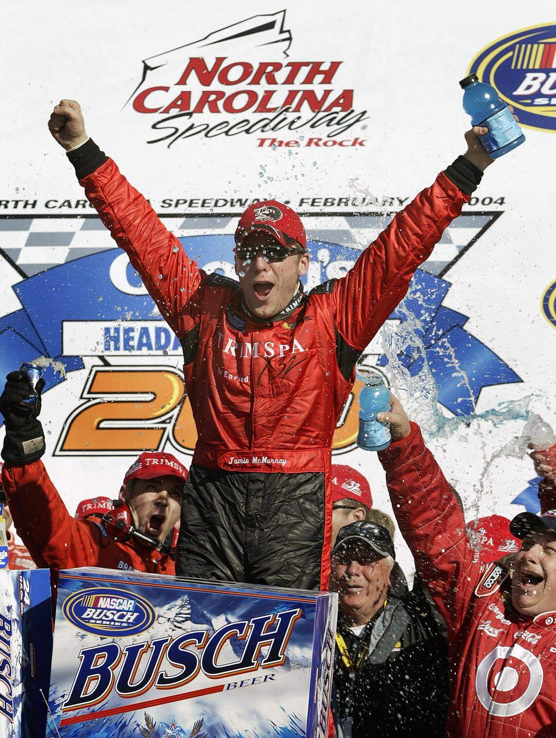 Jamie McMurray celebrates with his crew in Victory Lane after winning the NASCAR Busch Series auto race at North Carolina Speedway near Rockingham, N.C., Feb. 21, 2004. Rockingham is a rural track that lost its place on the NASCAR schedule as the sport gravitated toward larger and more profitable markets.