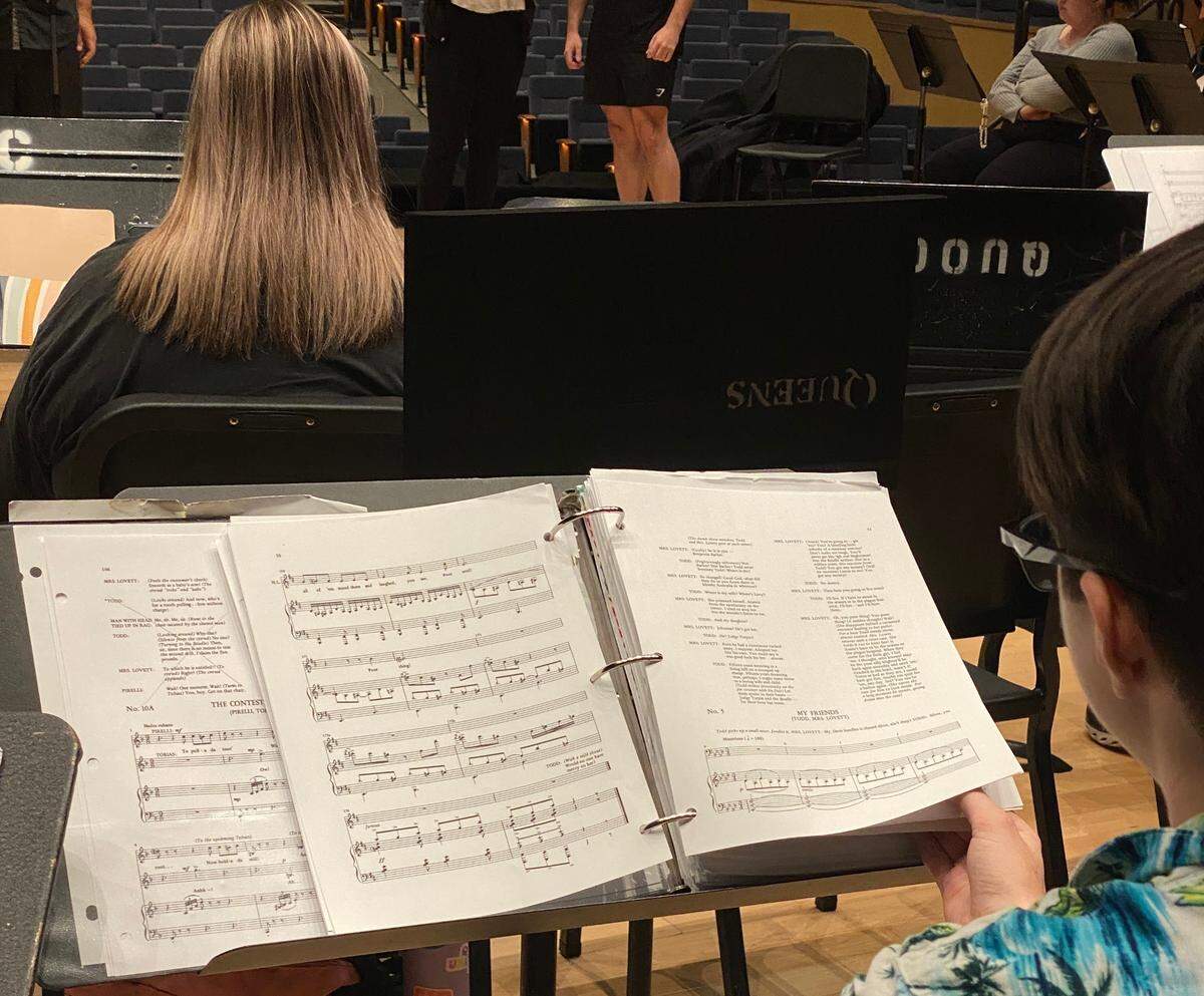 More than 80 people make up the cast and crew of Queens University’s performance. They have been rehearsing since January and spent the last two weeks staging for opening night.