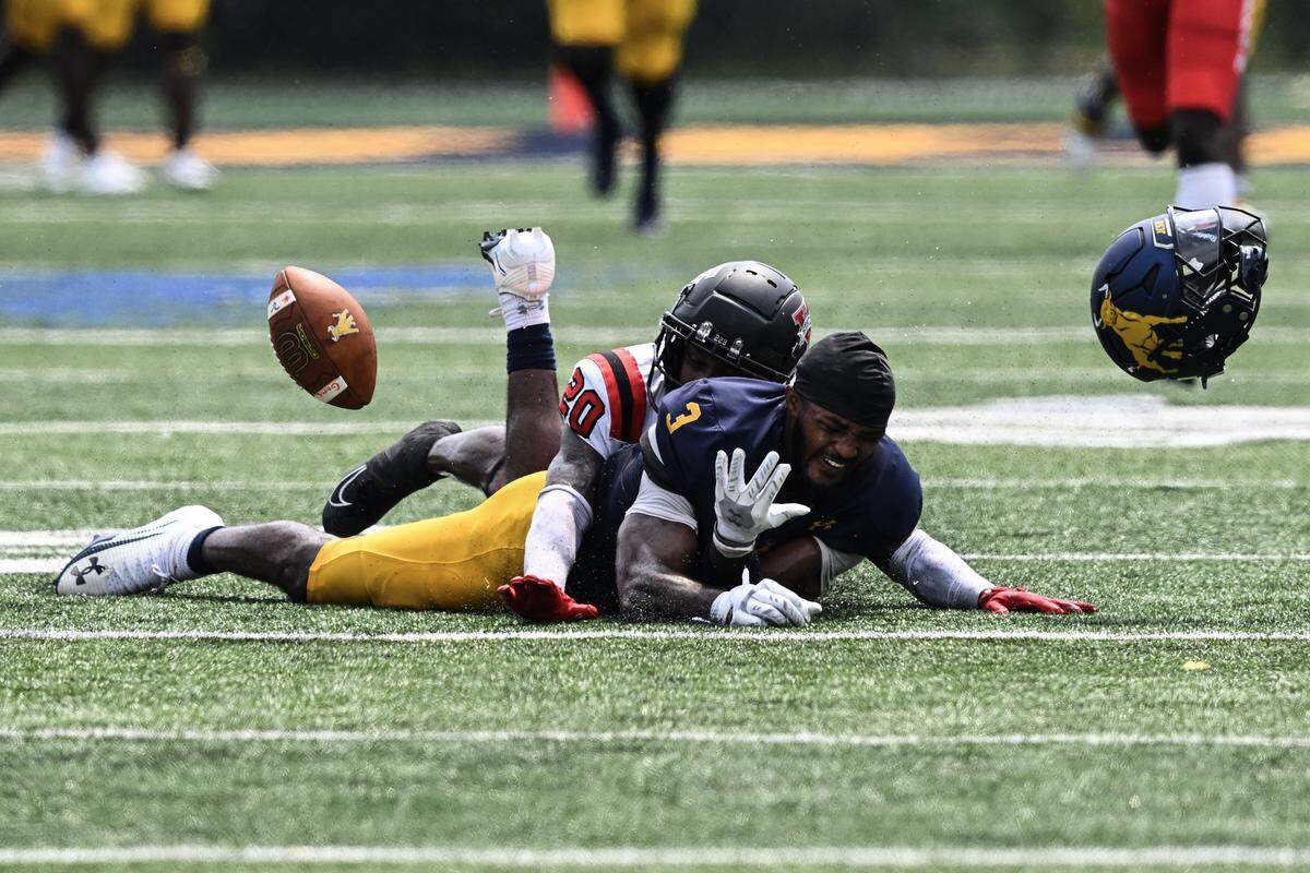 Valdosta State defensive back Theron Stroops (20) breaks up a pass intended for Johnson C. Smith wide receiver Deandre Proctor (3) during the first half of a CIAA football game Saturday, Sept. 6, 2025, in Charlotte, N.C.