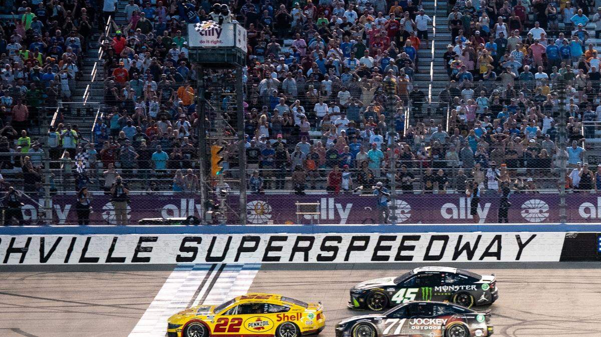 NASCAR Cup Series driver Joey Logano (22) crosses the finish line to win the Ally 400 tailed by Zane Smith (71) and Tyler Reddick (45) at Nashville Superspeedway in Lebanon, Tenn., Sunday, June 30, 2024.