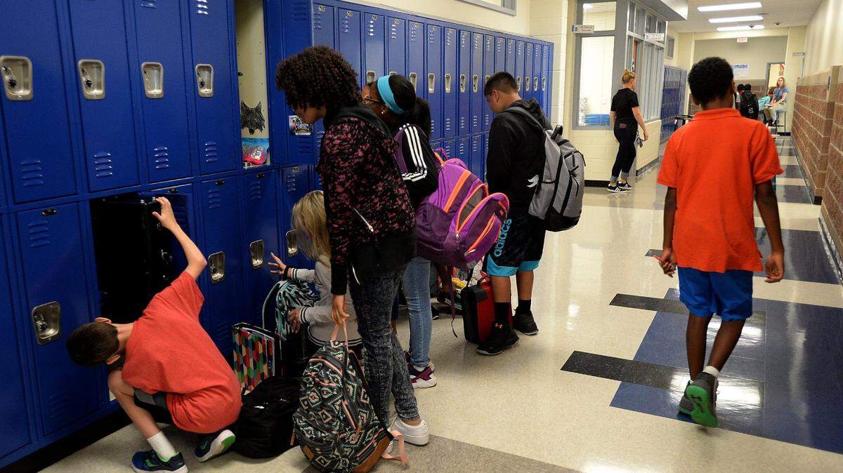 Students at their lockers at J.M. Alexander Middle School in Huntersville.