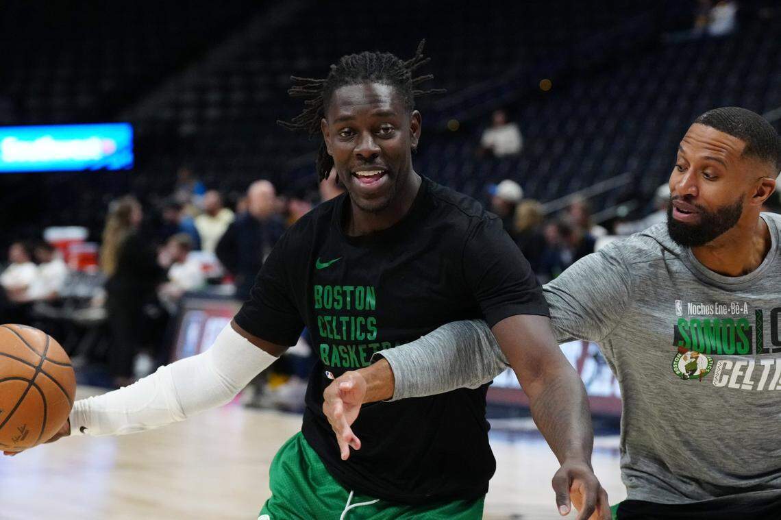 Boston Celtics guard Jrue Holiday (4) and assistant coach Charles Lee before the game against the Denver Nuggets at Ball Arena.
