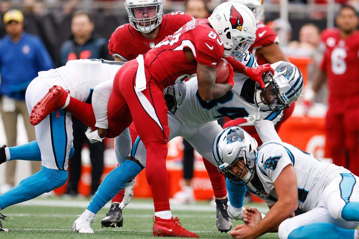 Arizona Cardinals wide receiver Greg Dortch (83) breaks a tackle by Carolina Panthers safety Sean Chandler (34) during a game at Bank of America Stadium in Charlotte, N.C., Sunday, Oct. 2, 2022.
