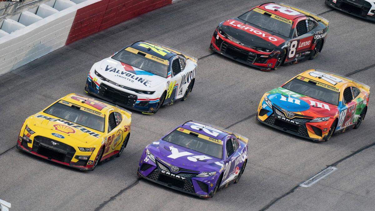Christoper Bell (21), Joey Lagano (22), William Byron (24), Kyle Busch (18) and Tyler Reddick (8) compete in the NASCAR Southern 500 auto race, Sunday, Sept. 4, 2022, in Darlington, S.C. (AP Photo/Sean Rayford)