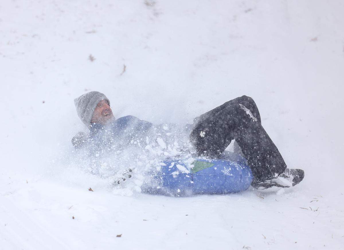 A man sleds in Cordelia Park in Charlotte, N.C., on Saturday, January 31, 2026.