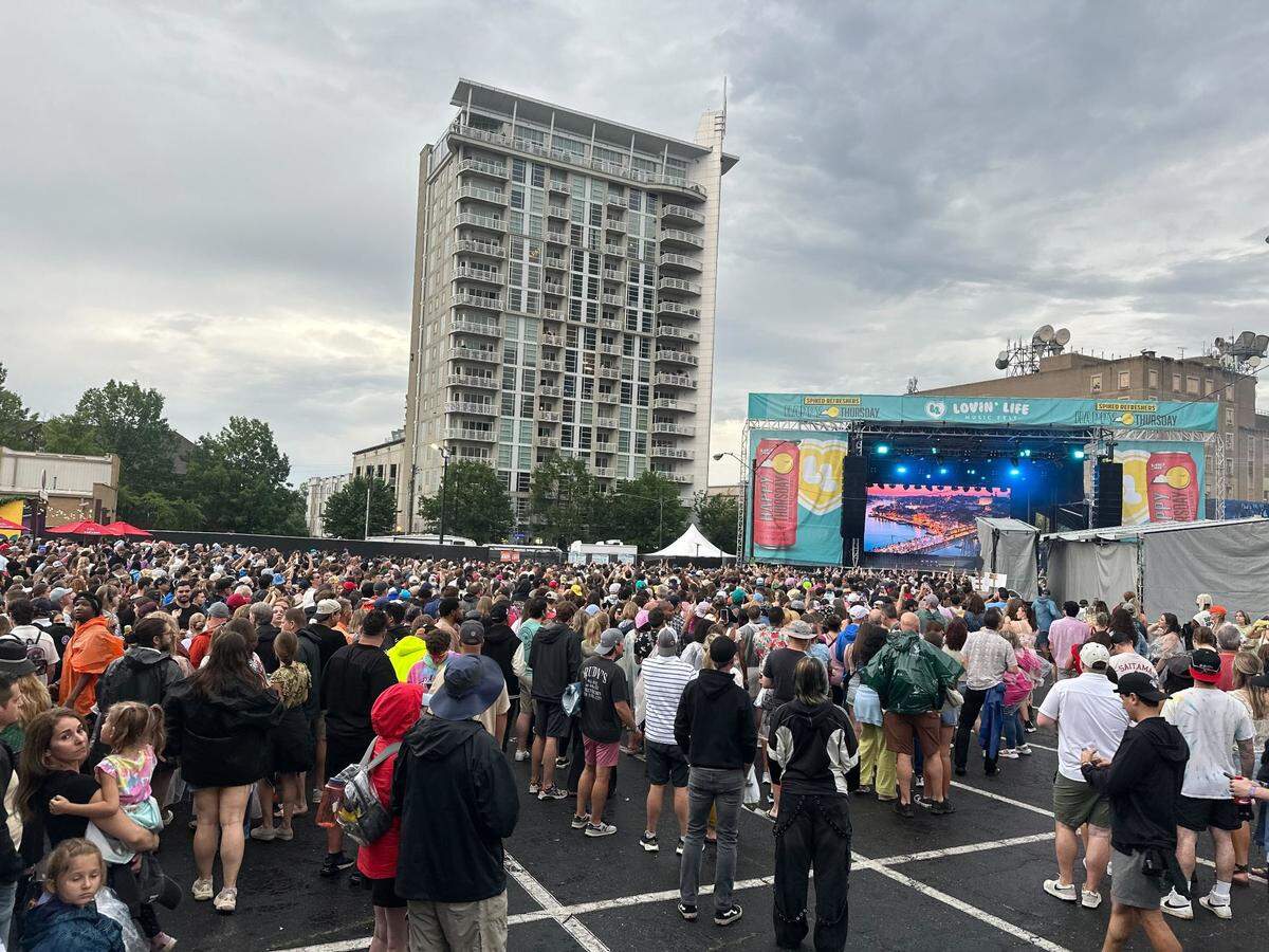 Fans return to the Lovin’ Life Music Fest festival grounds after a storm evacuation.
