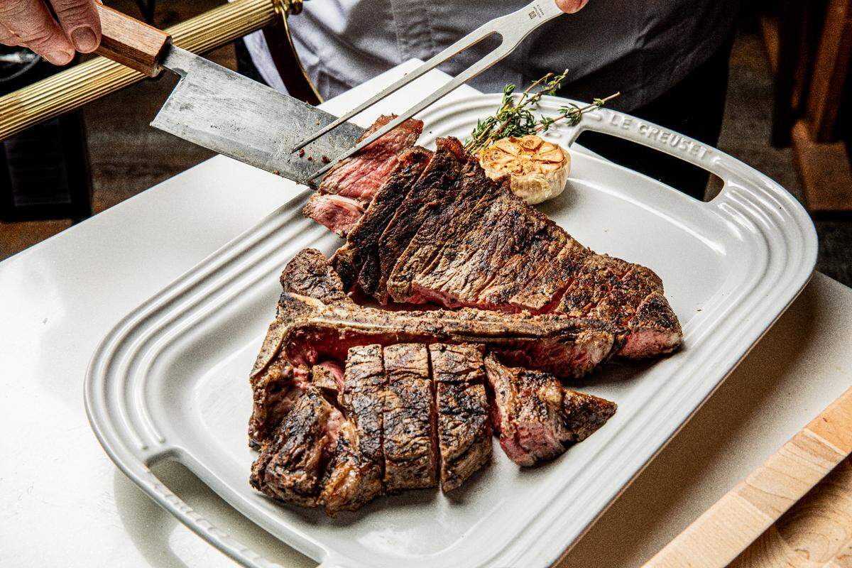 Oak Steakhouse offers a full menu of steaks and family-style sides to pair with them.