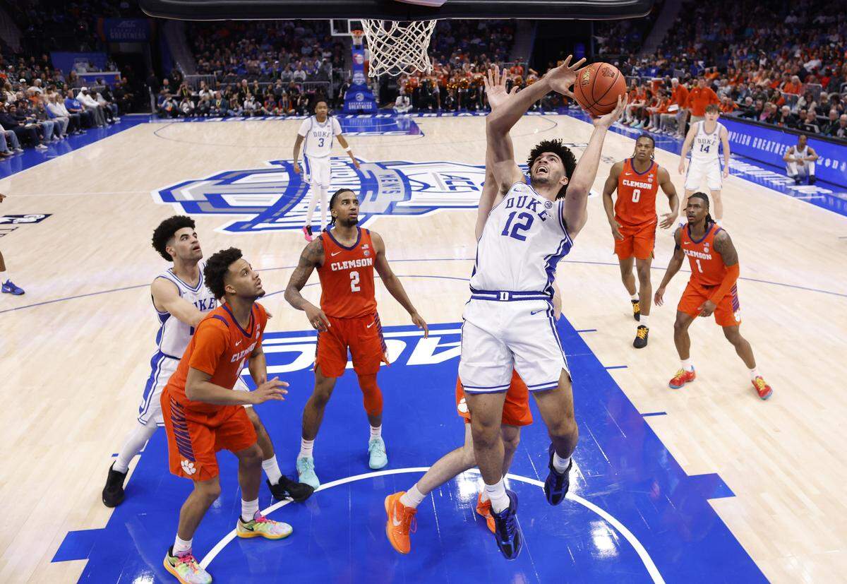 Duke’s Cameron Boozer (12) heads to the basket during Duke’s 73-61 victory over Clemson in the semifinals of the 2026 ACC Men’s Basketball Tournament at the Spectrum Center in Charlotte, N.C., Friday, March 13, 2026.