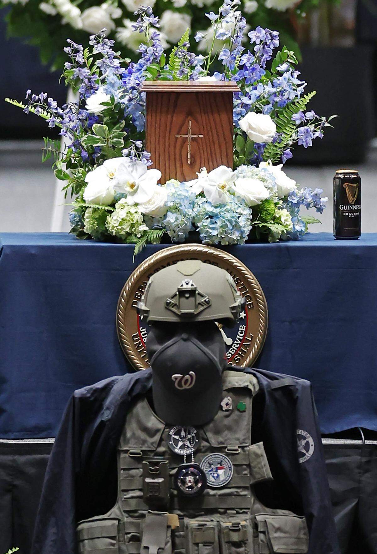 U.S. Marshal Thomas Weeks Jr.’s, gear and body stand during a memorial to the slain officer at Bojangles Coliseum in Charlotte, NC on Monday, May 6, 2024. U.S. Marshal Thomas Weeks Jr., died during a standoff with a gunman on Monday, April 29th 2024. Two other law enforcement officers were also killed in the shootout. CMPD Officer Joshua Eyer passed away later Monday evening from injuries sustained during the shootout.