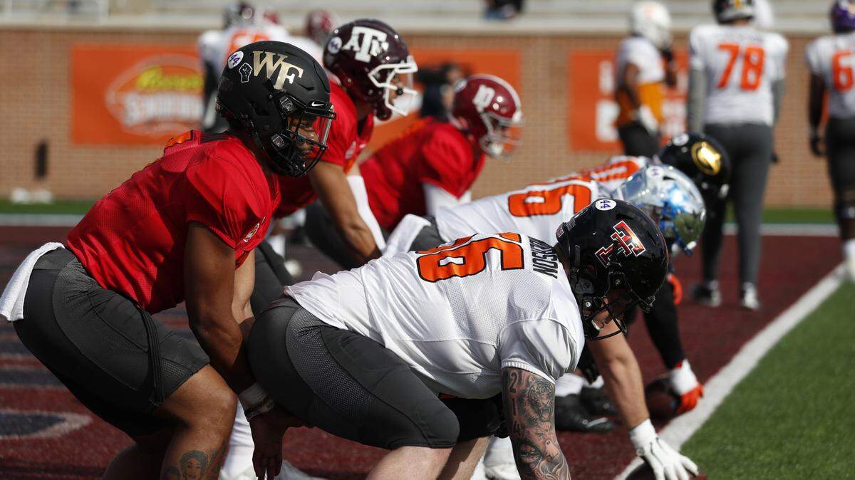 Former Wake Forest QB Jamie Newman prepares to take a snap at Senior Bowl practice on Wednesday in Mobile, Ala.