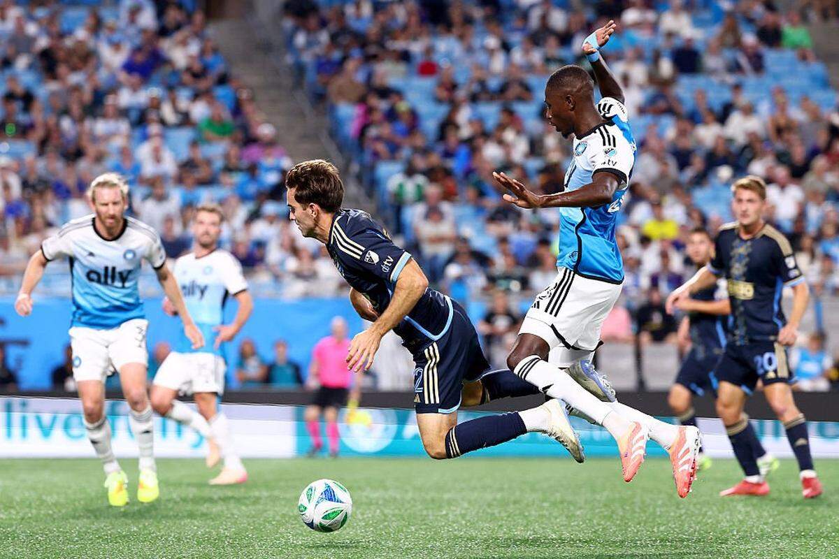 Djibril Diani (28) of Charlotte FC collides with Milan Iloski (32) of Philadelphia Union vie for the ball during the first half of the MLS match between Philadelphia Union and Charlotte FC at Bank of America Stadium on October 18, 2025 in Charlotte, North Carolina.