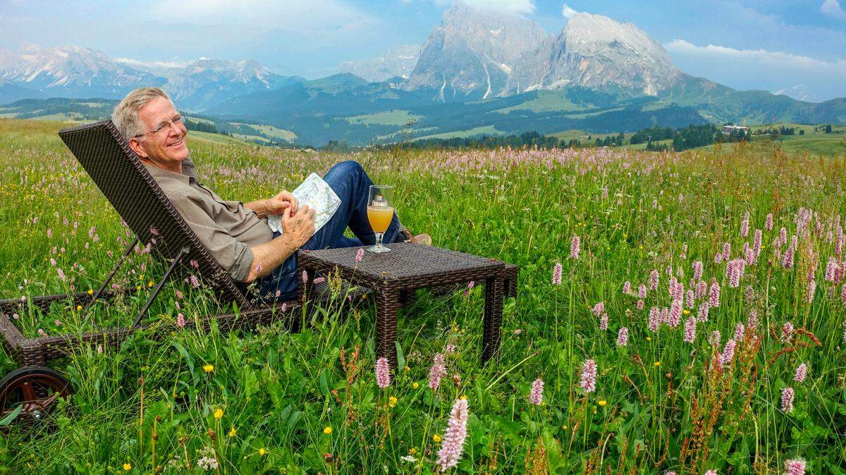 Rick Steves taking a break from filming in Italy’s Dolomites. Steves visited Charlotte to speak at a lecture for the World Affairs Council of Charlotte on Thursday, Feb. 15.