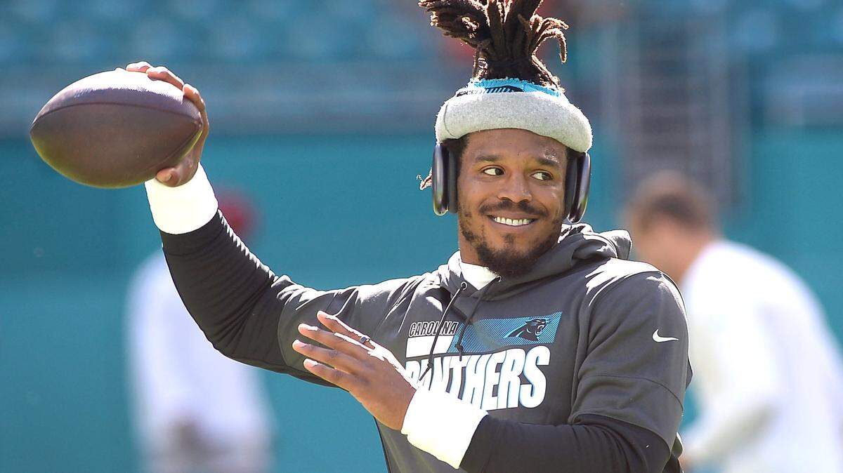 Carolina Panthers quarterback Cam Newton warms up on the field at Hard Rock Stadium in Miami Gardens, Fla. on Sunday, November 28, 2021. The Panthers play the Miami Dolphins in NFL action.