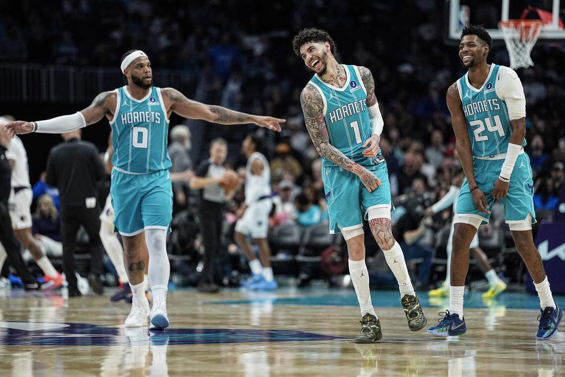 Charlotte Hornets guard LaMelo Ball (1) reacts alongside teammates forward Miles Bridges (0) and forward Brandon Miller (24) during the Hornets’ 117-90 win over Dallas Tuesday.