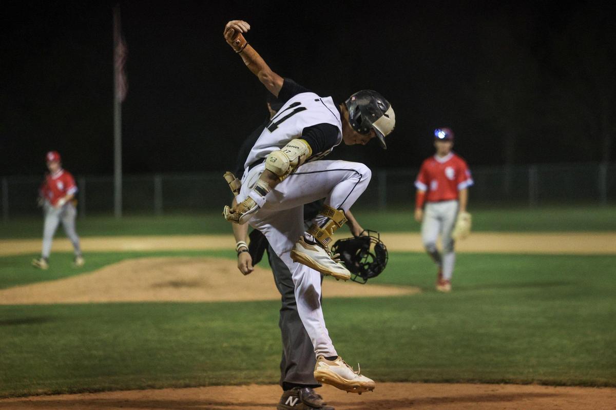 Providence’s Xavier McCoury leaps onto home plate after hitting a home run in the bottom of the eigth inning, giving them a 5-4 victory over Charlotte Catholic in the Southwestern 4A championship baseball game at Garinger High School in Charlotte, NC on Thursday, May 1, 2025.
