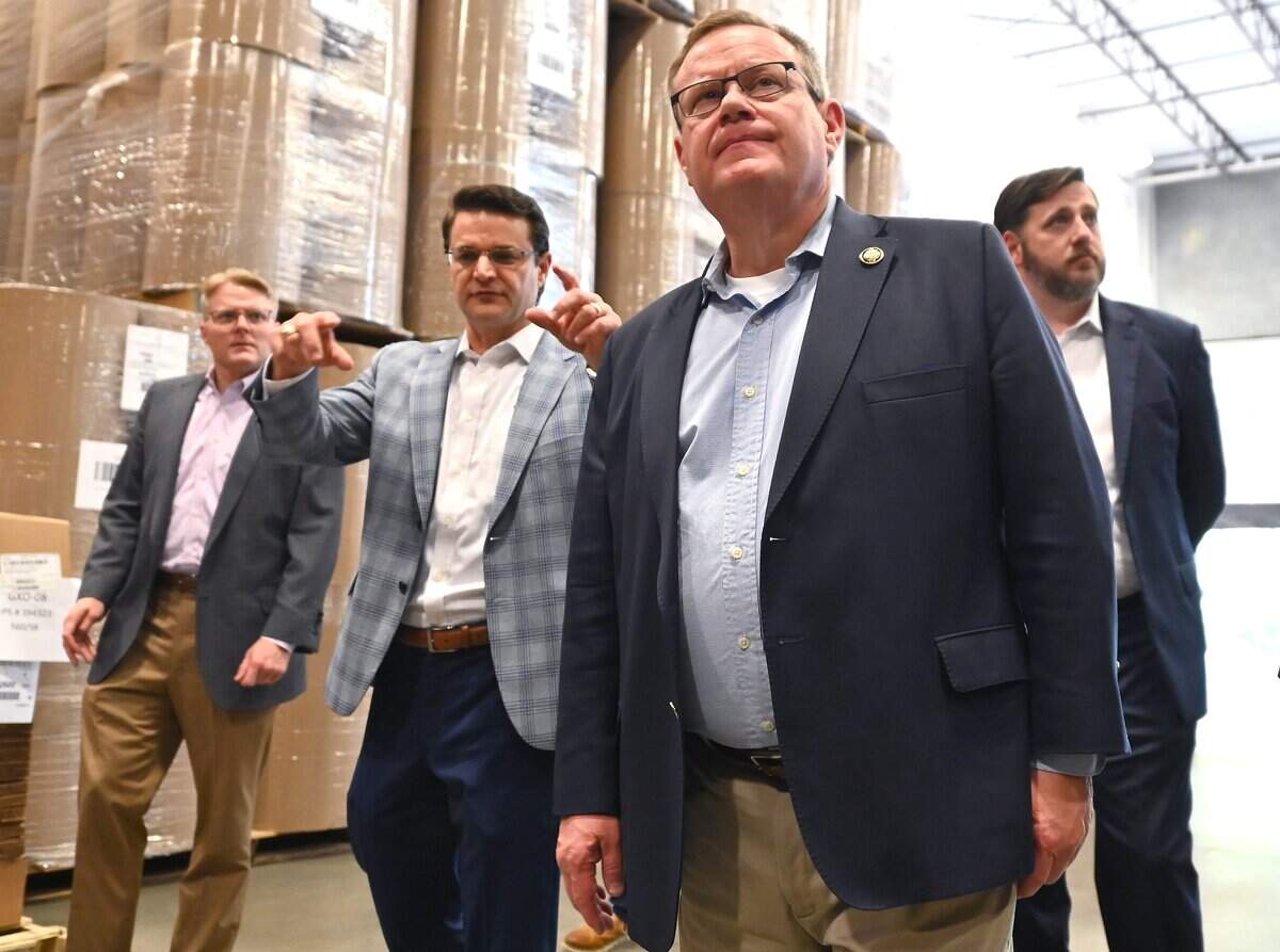Derrick Murdock, Chief Executive Officer for IPS Packaging and Automation, left, explains how the company operates to Congressman Tim Moore, right, during a tour of the facility on Friday, August 15, 2025 in Charlotte, NC.