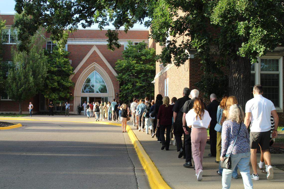 A line waiting to enter a prayer vigil for Annunciation Church shooting victims shortly before 7 p.m. on Aug. 27 at Academy of Holy Angels High School in Richfield, Minnesota.