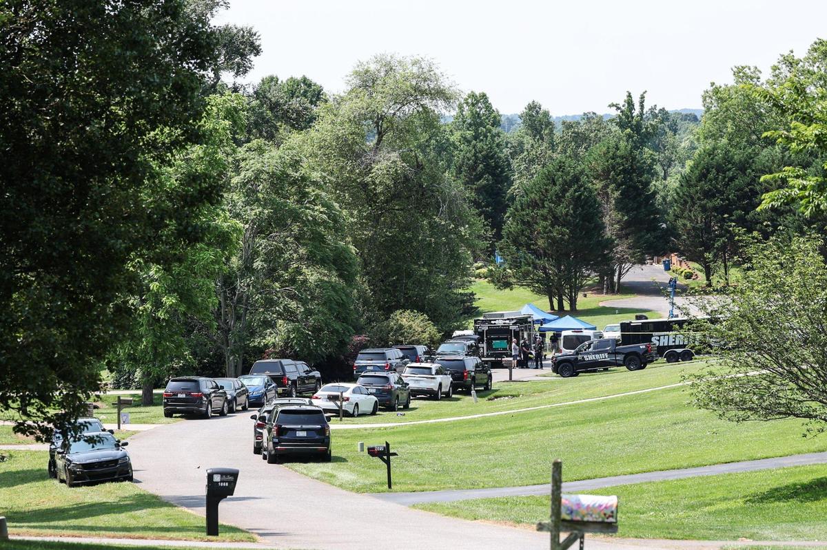 Catawba County Sheriffs investigate the scene of a shooting in the Walnut Acres community in Mountain View on Monday June 2, 2025. Sunday night 80 shots were fired during a mass shooting at a party outside Hickory killing 1, unjuring 11.