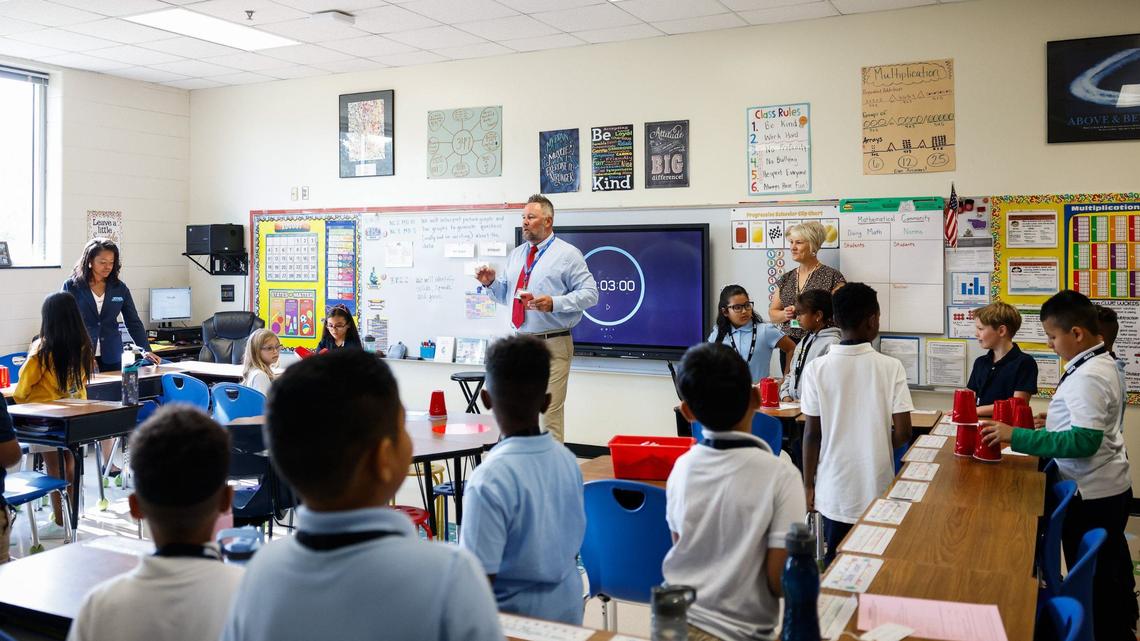 Some teachers are speaking out about potential health insurance cost increases because of proposed state health plan changes. In this 2024 file photo, teacher Paul Michael Williams works with students at Idlewild Elementary School in Charlotte.