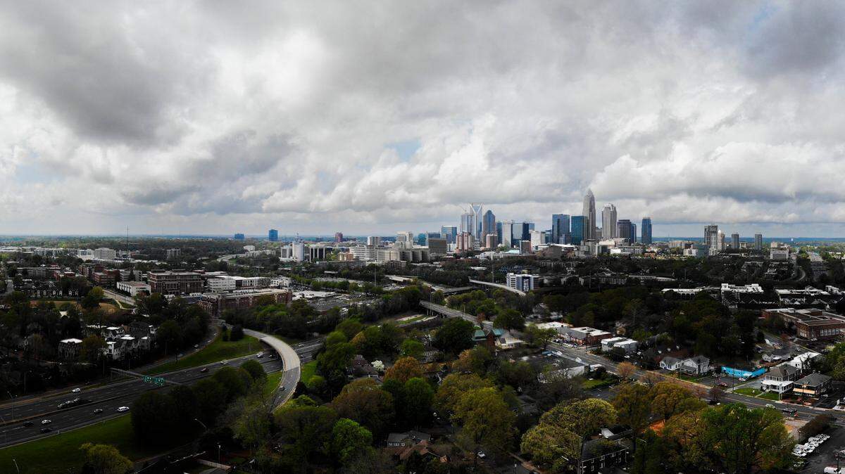 A composite image shows rain clouds over the skyline in Charlotte, NC, on Thursday, April 7, 2022.
