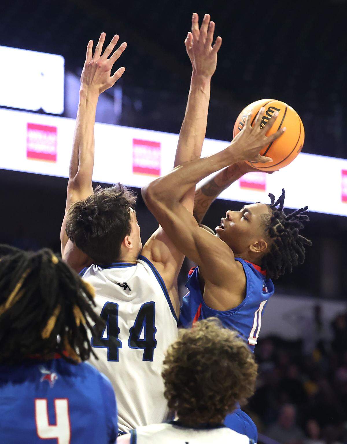 North Meck’s Isaiah Evans, right, drives into the lane for a shot attempt as Lake Norman’s Trent Stelhour, left, applies defensive pressure during the AAAA Regional Championship on Thursday, March 14, 2024 at Lawrence Joel Veterans Memorial Coliseum in Winston-Salem, NC. North Meck defeated Lake Norman 65-61.