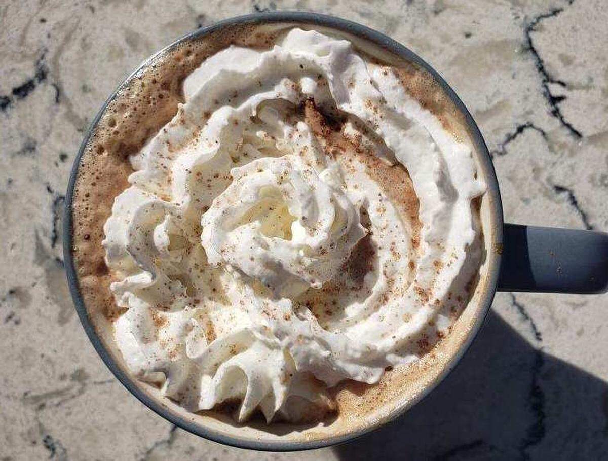 The peppermint mocha includes chocolate, espresso, milk and peppermint topped with whipped cream.