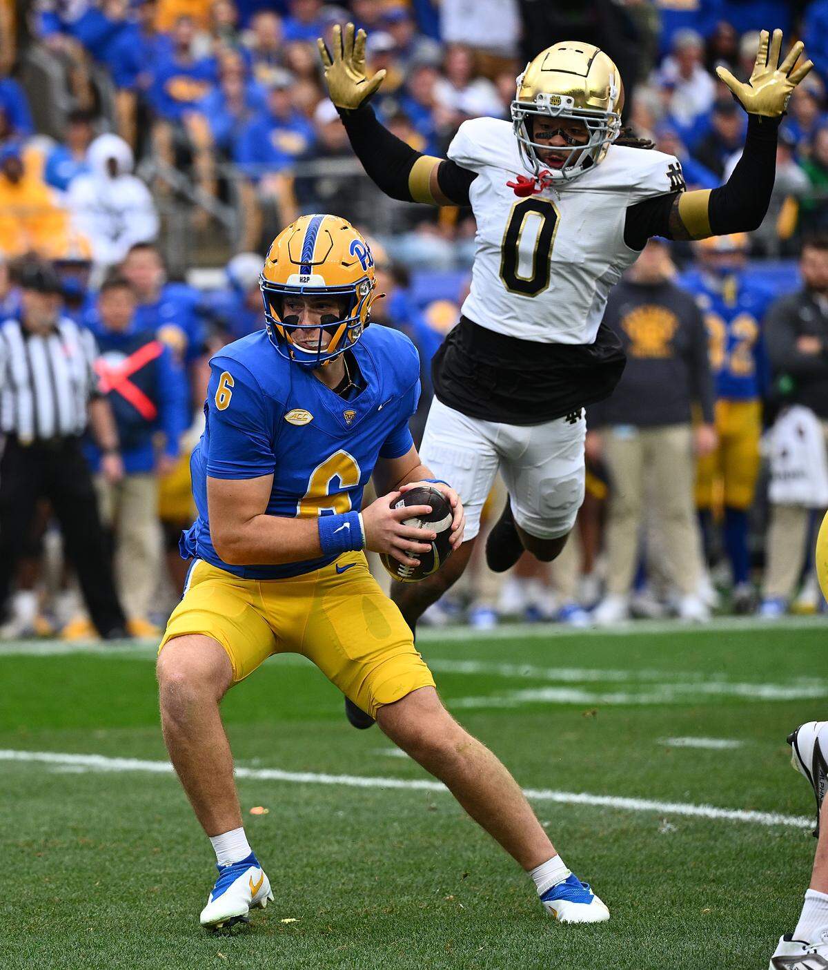 Pittsburgh Panthers quarterback Mason Heintschel tries to avoid the rush of Notre Dame Fighting Irish cornerback Devonta Smith at Acrisure Stadium on November 15, 2025 in Pittsburgh, Pennsylvania. (Photo by Justin Berl/Getty Images)