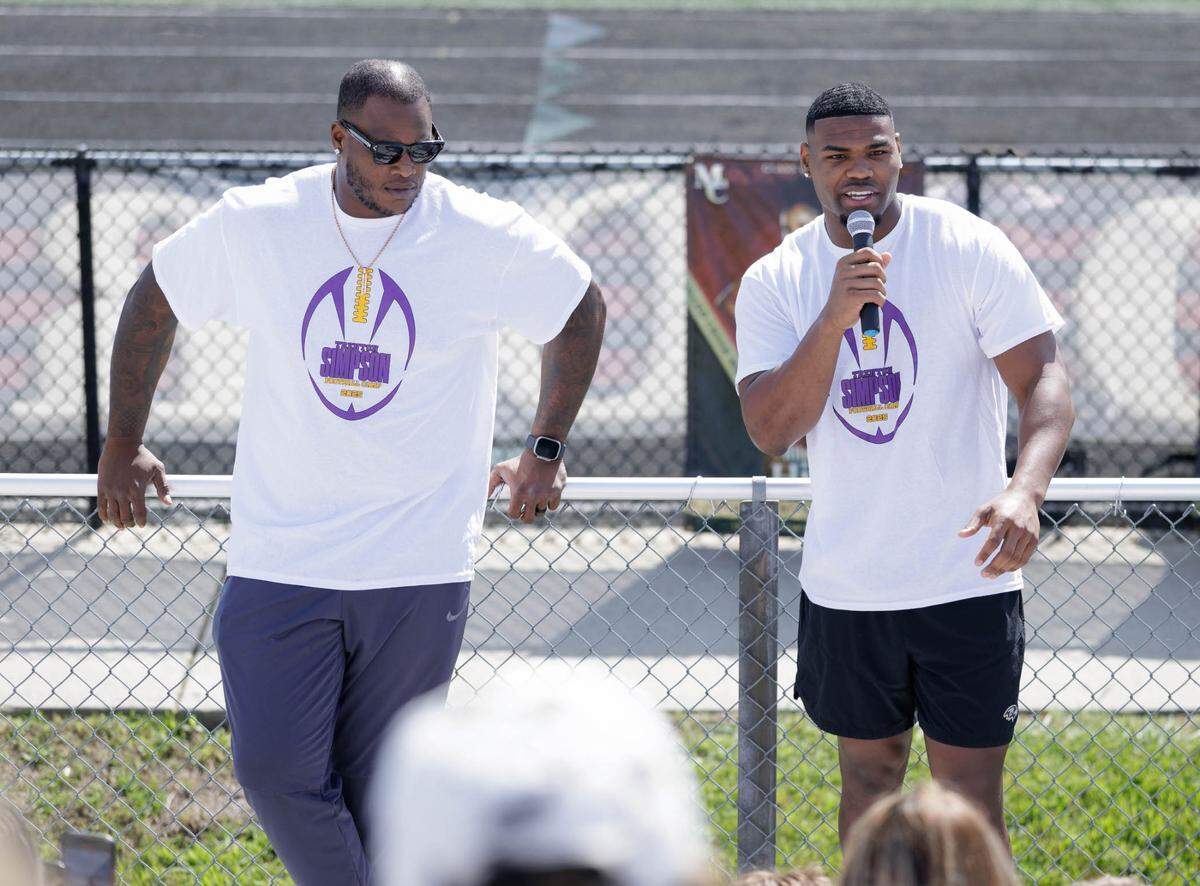 Former Mallard Creek high stars DJ Humphries (left) and Trent Simpson are now both NFL players. They addressed youth at Simpson’s free camp at Mallard Creek Saturday