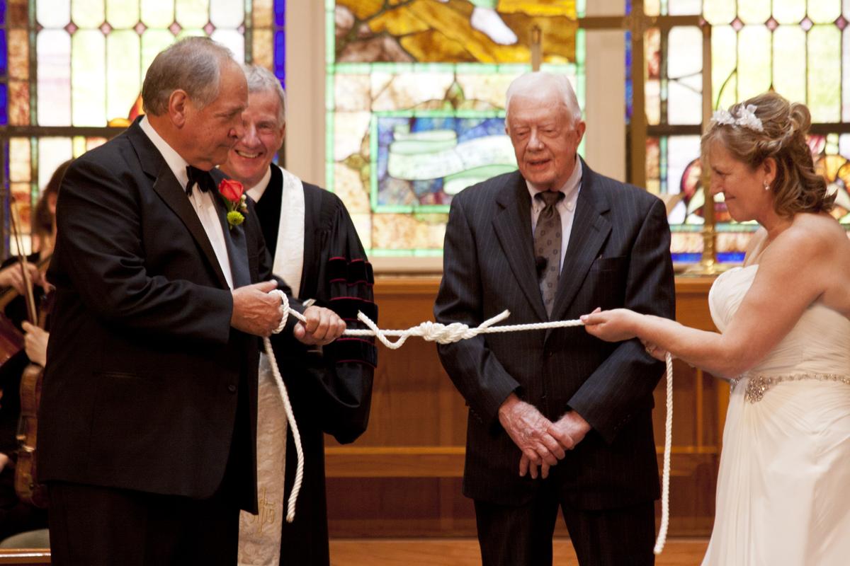 Jimmy Carter, center, presides over Bob Wilson's wedding to Ineke in 2014.