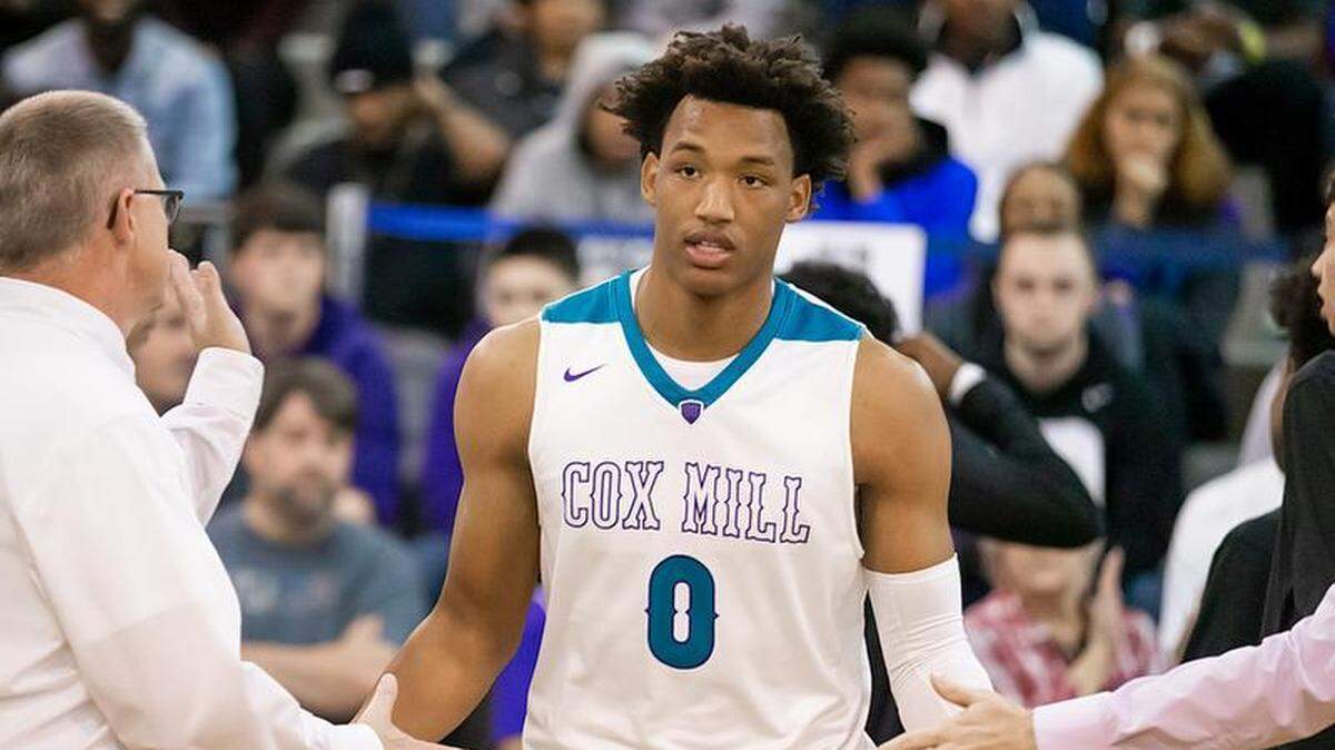 Concord Cox Mill’s Wendell Moore is introduced into the starting lineup before Saturday’s game with Olympic