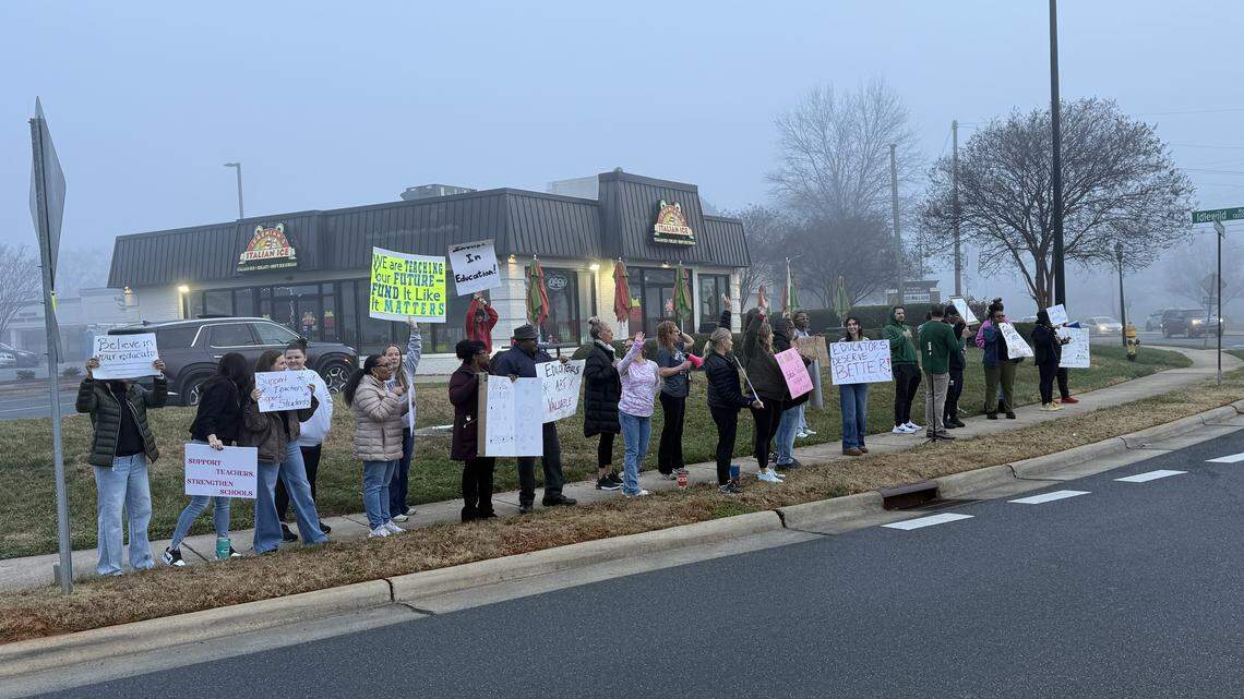 Educators gather in Mint Hill to demand higher funding for public education during a protest on the corner of Matthews-Mint Hill Road and Idlewild Road.