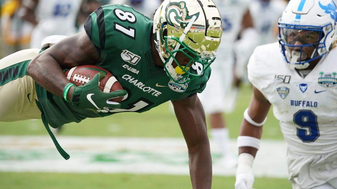 Charlotte’s Tyler Ringwood dives for extra yardage on Friday in the Bahamas Bowl against Buffalo.