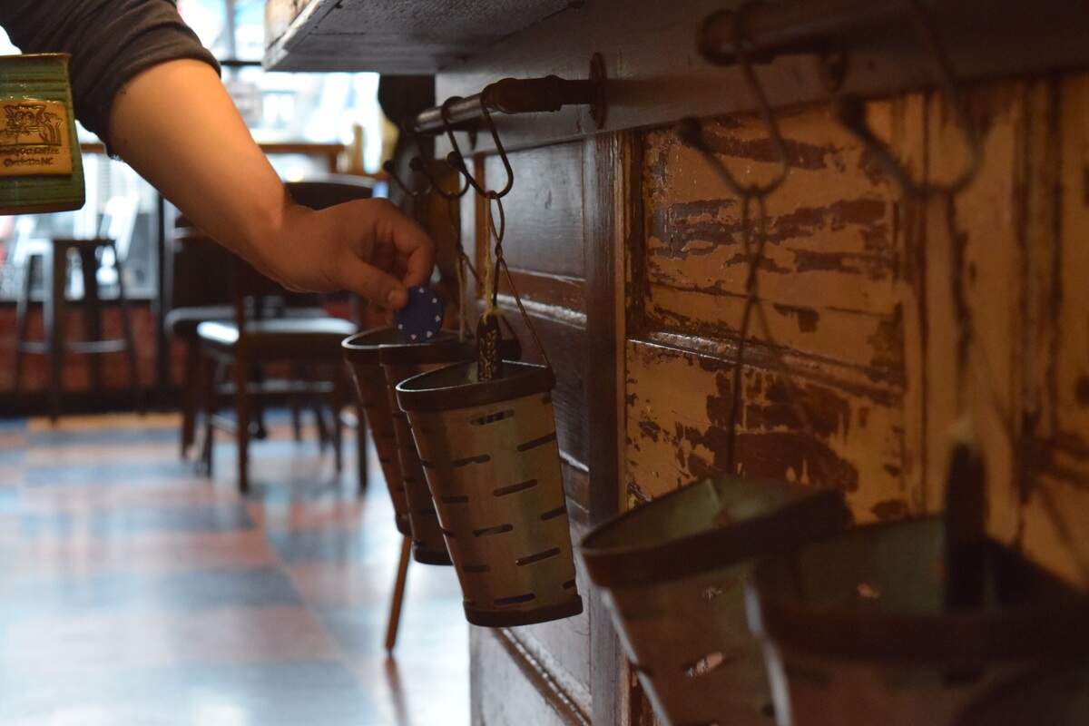 When Smelly Cat Coffee customers bring their own cup, they can choose a charity they want Smelly Cat to donate 35 cents to by placing a poker chip in a bucket.