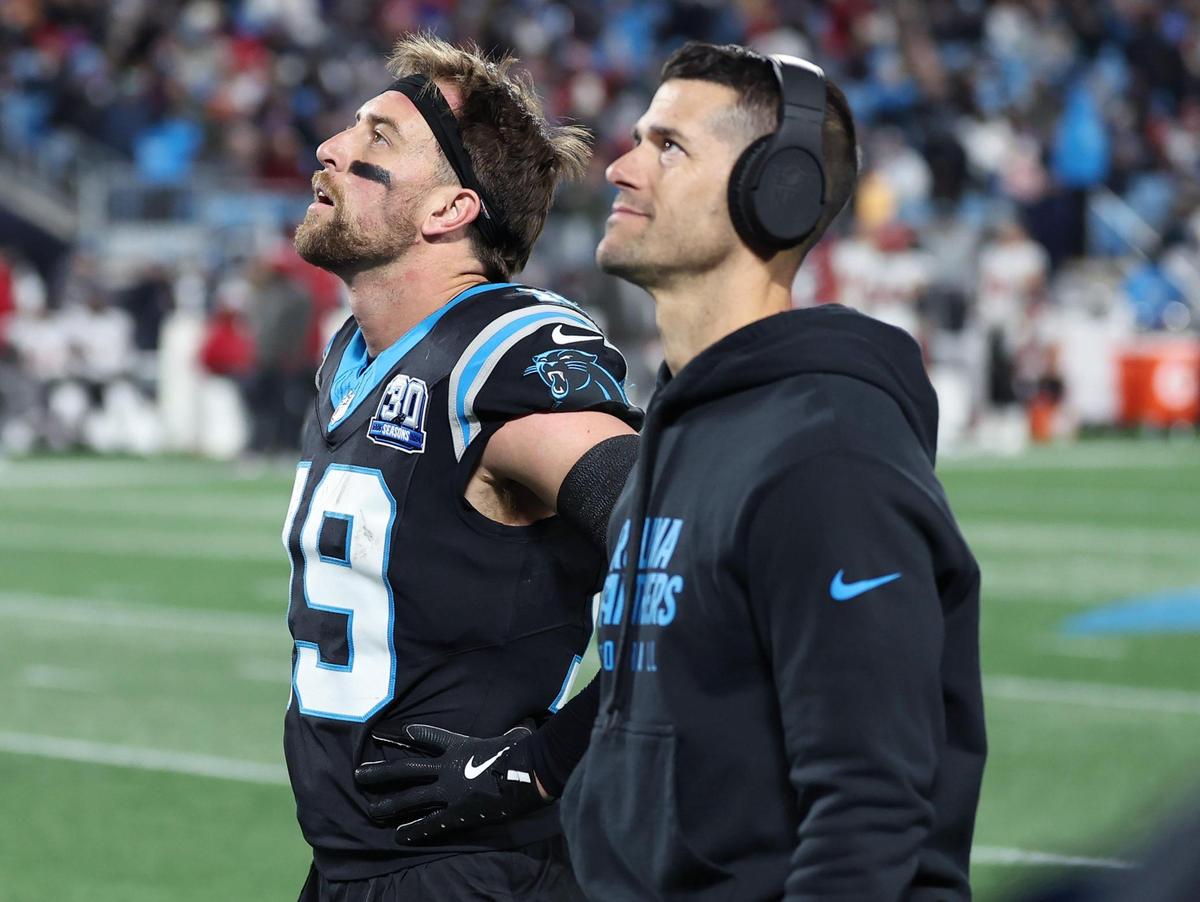 Carolina Panthers wide receiver Adam Thielen, left and head coach Dave Canales watch a replay of Thielen’s touchdown pass reception in the end zone during late first half action against the Tampa Bay Buccaneers at Bank of America Stadium in Charlotte, NC on Sunday, December 1, 2024. The play was initially ruled a touchdown and then overturned.
