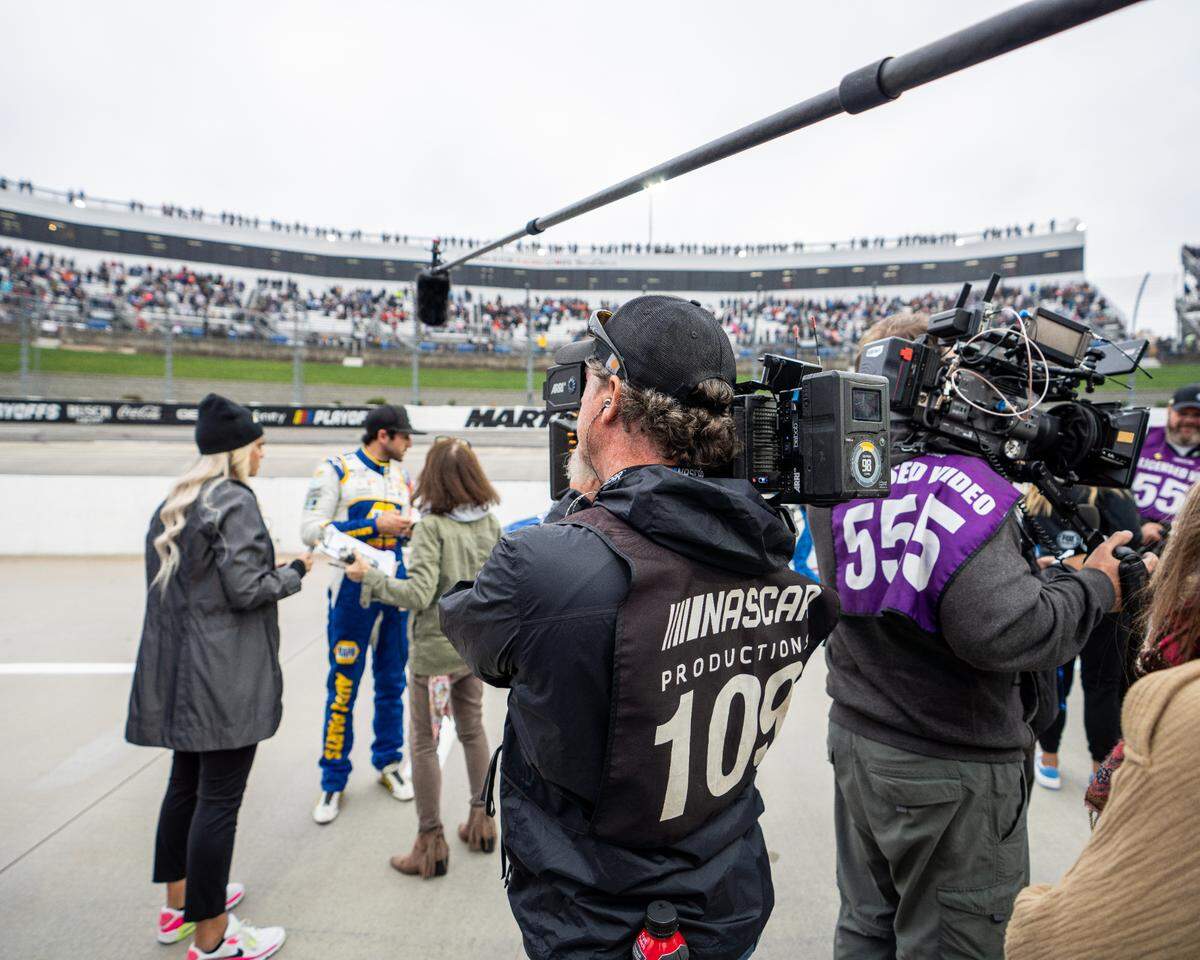 A videographer for Race For The Championship focuses in on Chase Elliott as he gives a pre-race interview with NASCAR Studios.