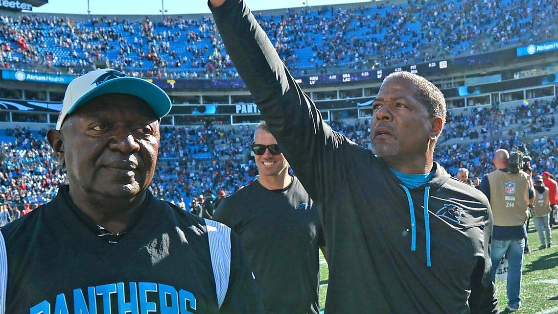 Carolina Panthers interim head coach Steve Wilks, right, points up into the stands following the team’s victory over the Tampa Bay Buccaneers at Bank of America Stadium in Charlotte, NC on Sunday, October 23, 2022. The Panthers defeated the Buccaneers 21-3.