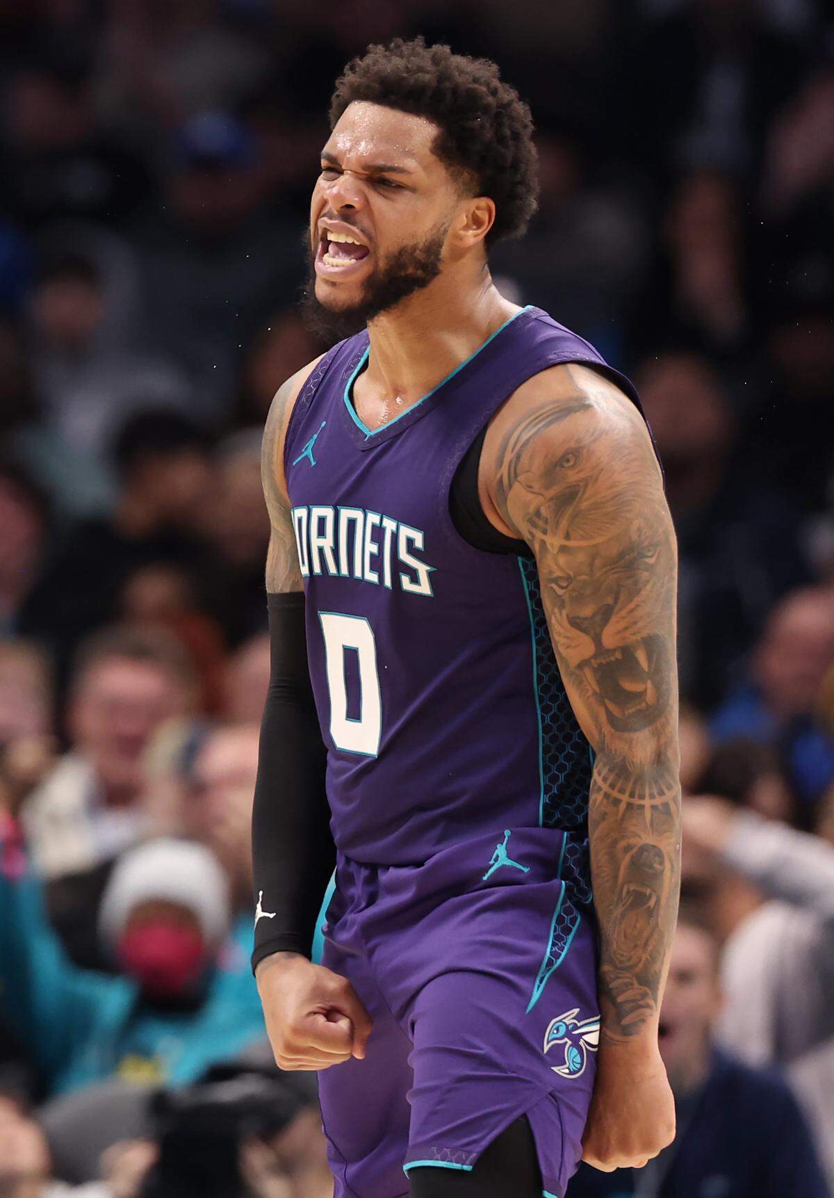 Charlotte Hornets forward Miles Bridges celebrates a dunk against the Dallas Mavericks during action at Spectrum Center in Charlotte, NC on Monday, January 20, 2025.