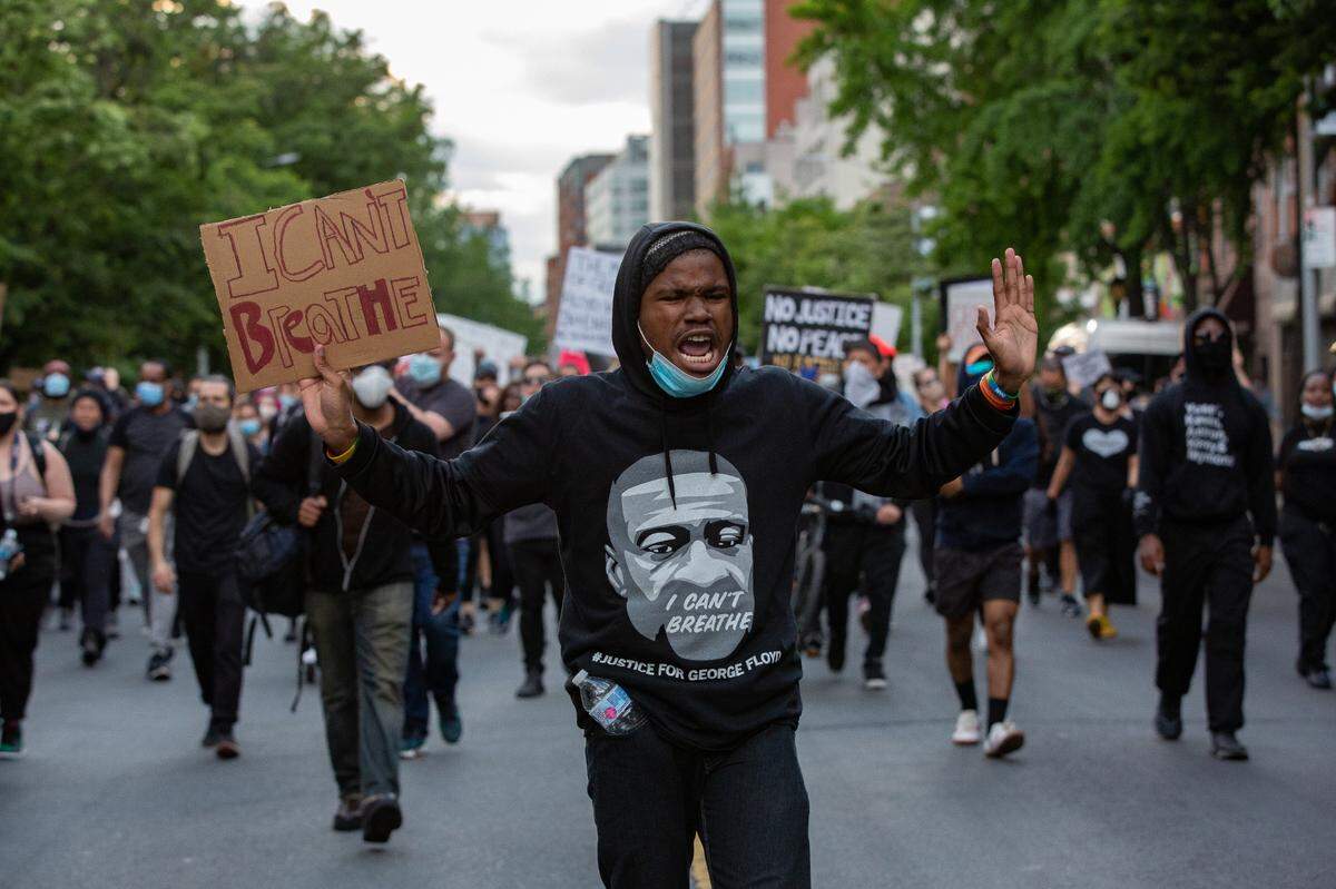 After spending months photographing protests, E. Mackey produced a book, “Lift Every Voice.”