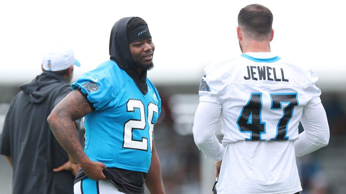 Carolina Panthers running back Rashaad Penny, left and linebacker Josey Jewell, right, talk prior to the start of training camp practice on Thursday, July 25, 2024.