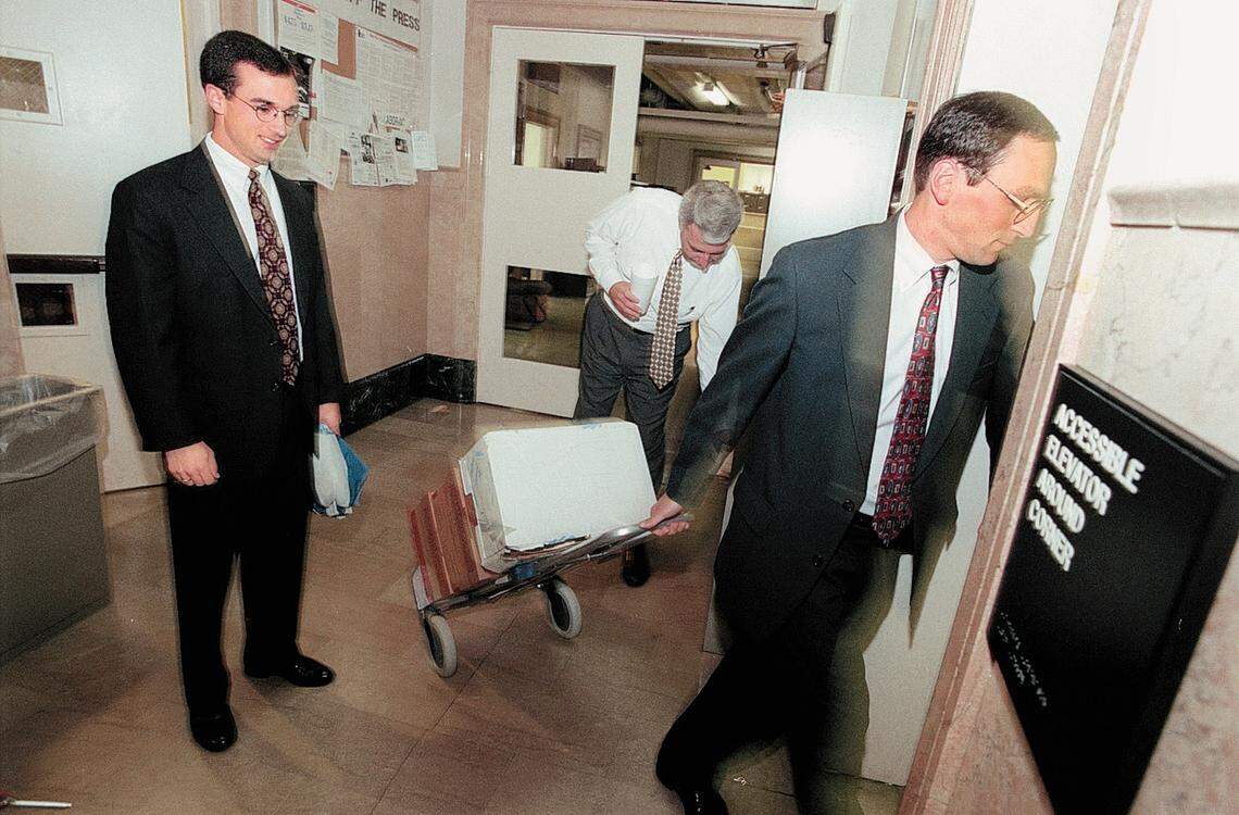 7/13/99  Mecklenburg Assistant District Attorneys(l to r) Glenn Cole and Jay Ashendorf  board the elevator with boxes of case file headed for morning court across the street to the courthouse.N "DOING THE CRIME BUT NOT THE TIME" SERIES.