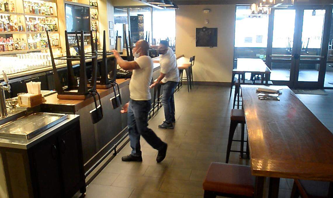 Staff at Sea Level NC restaurant in uptown Charlotte prepare to opening up for the evening on Friday, July 24, 2020. Restaurants uptown are struggling with no events, office foot traffic, and new COVID restrictions on their business.