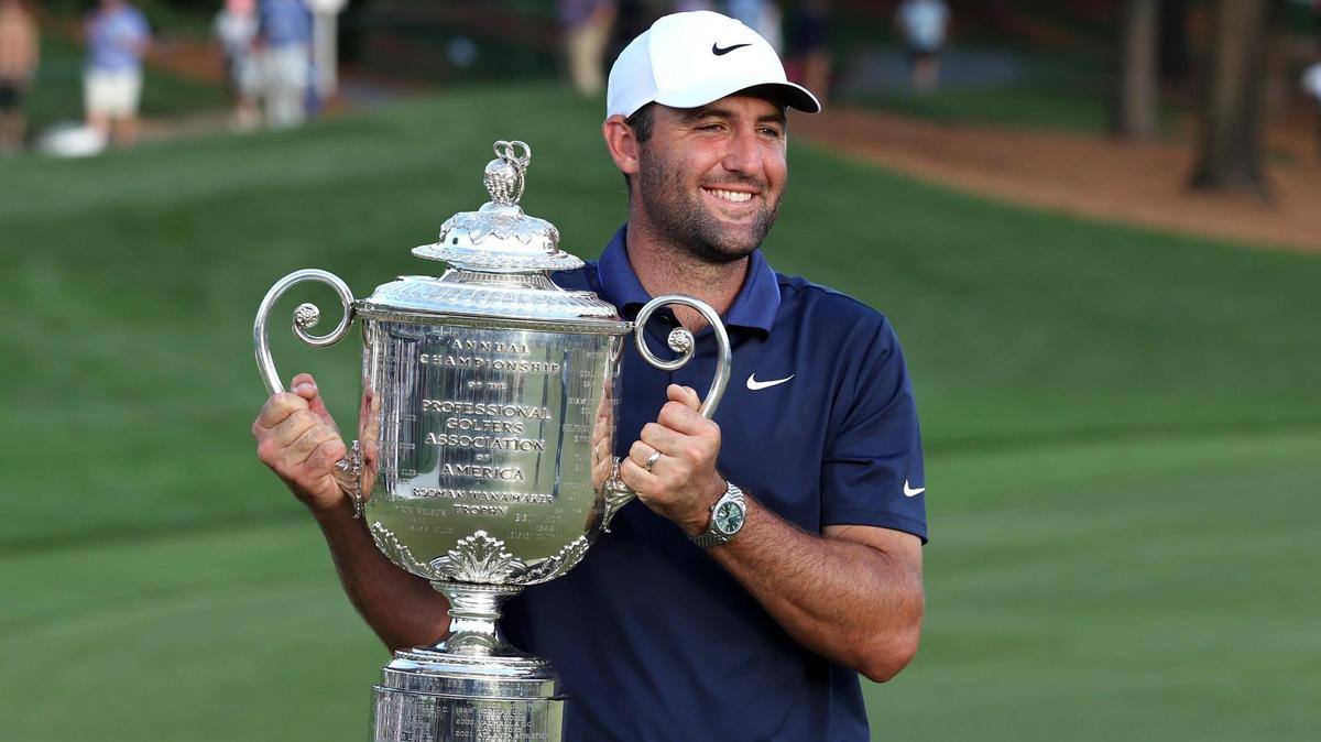 Scottie Scheffler holds the Wanamaker Trophy after winning the PGA Championship at Quail Hollow Club in Charlotte, NC on Sunday, May 18, 2025. Scheffler shot -11 for the tournament.