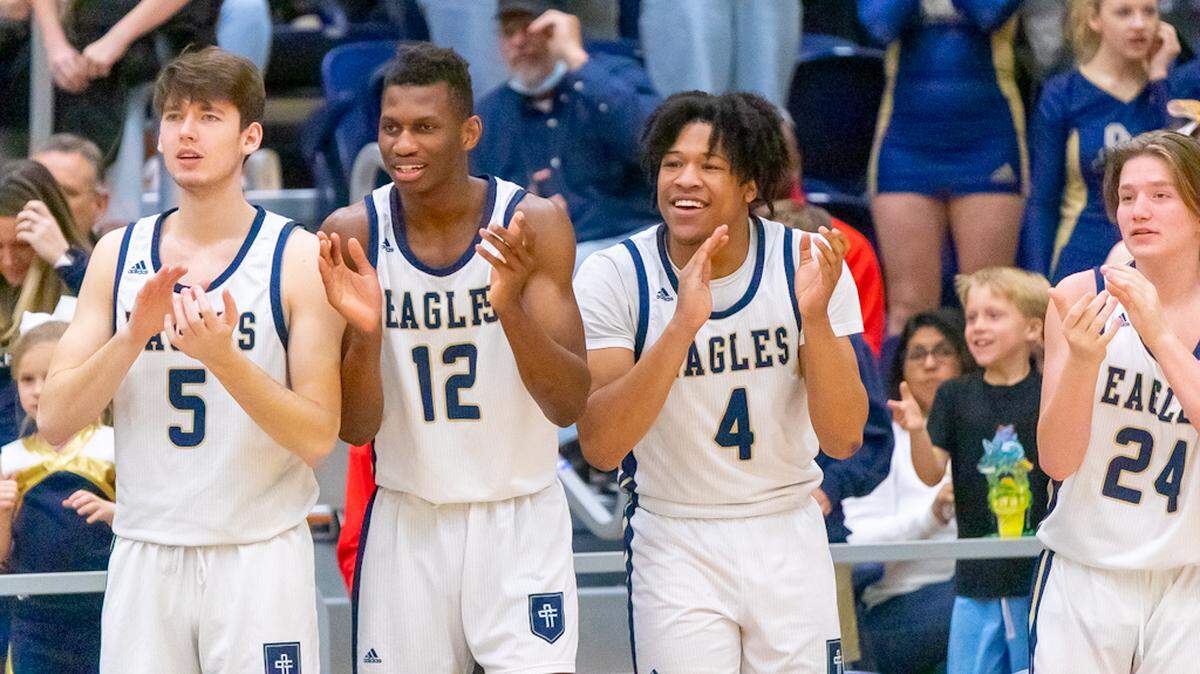 Concord Academy Eagles cheer on their team as they take the lead