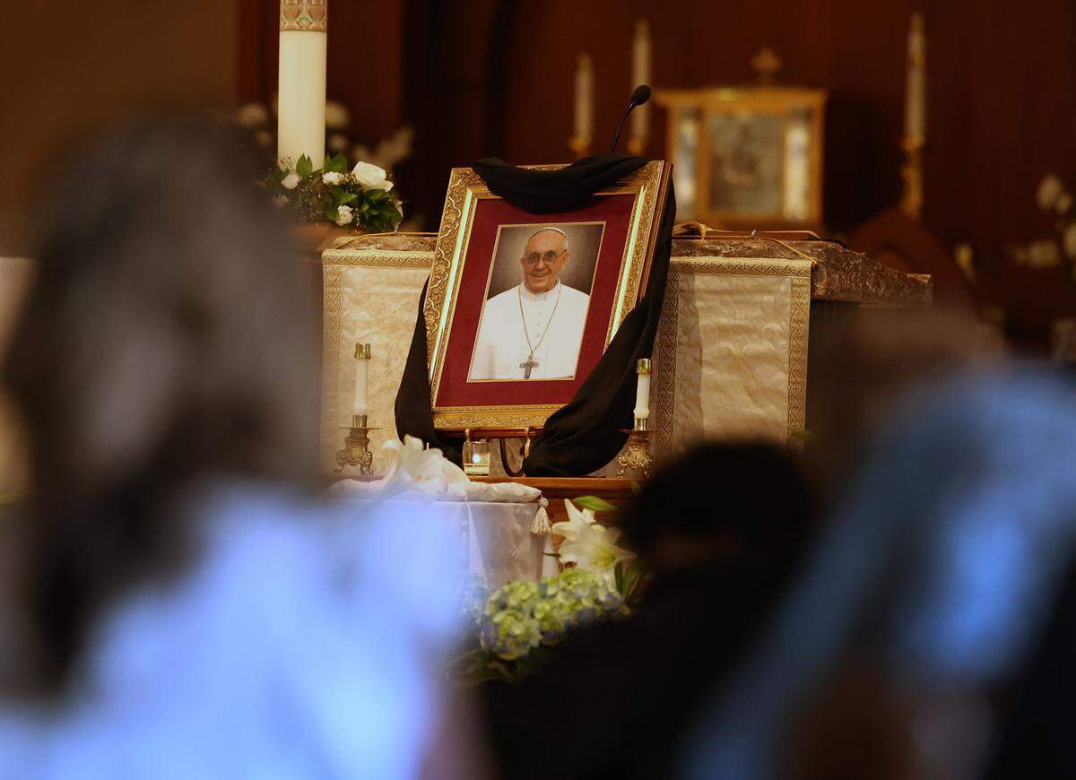 Parishioners kneel in prayer during a Mass for Deceased Pope Francis on Wednesday at Saint Mark Catholic Church in Huntersville.