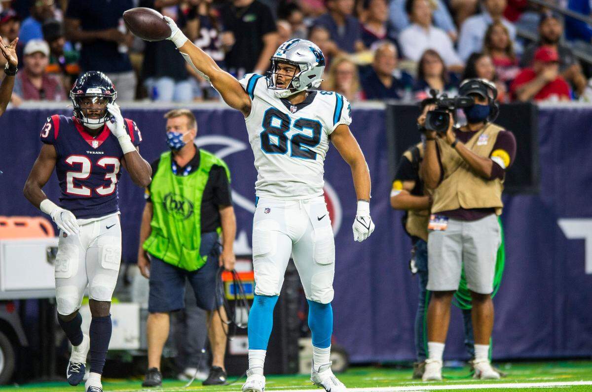 Panthers tight end Tommy Tremble, left, celebrates after a 30-yard catch on his first-ever NFL reception.
