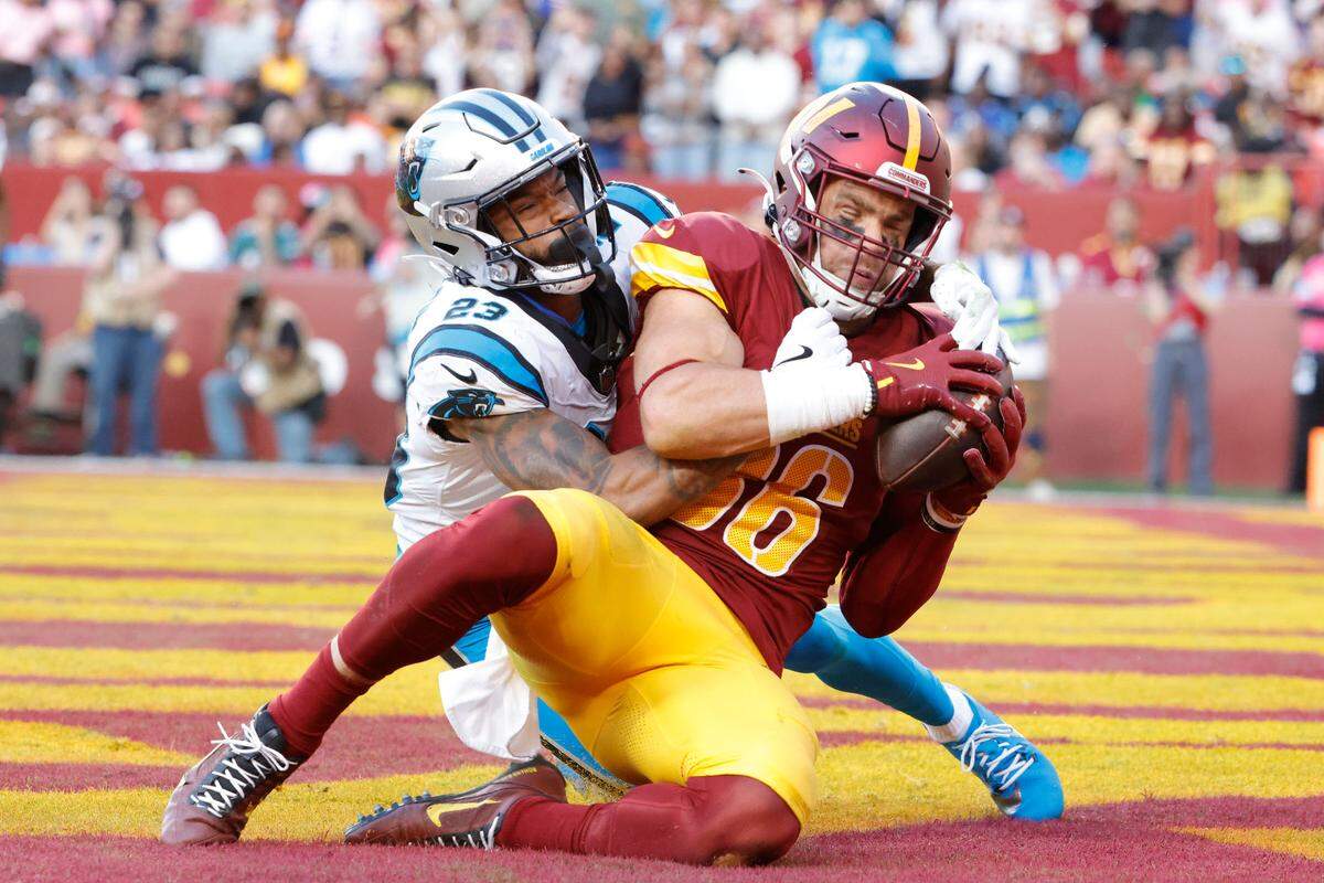 Washington Commanders tight end Zach Ertz (86) catches a touchdown pass as Carolina Panthers cornerback Dane Jackson (23) defends during the second quarter at Northwest Stadium on Oct 20, 2024.