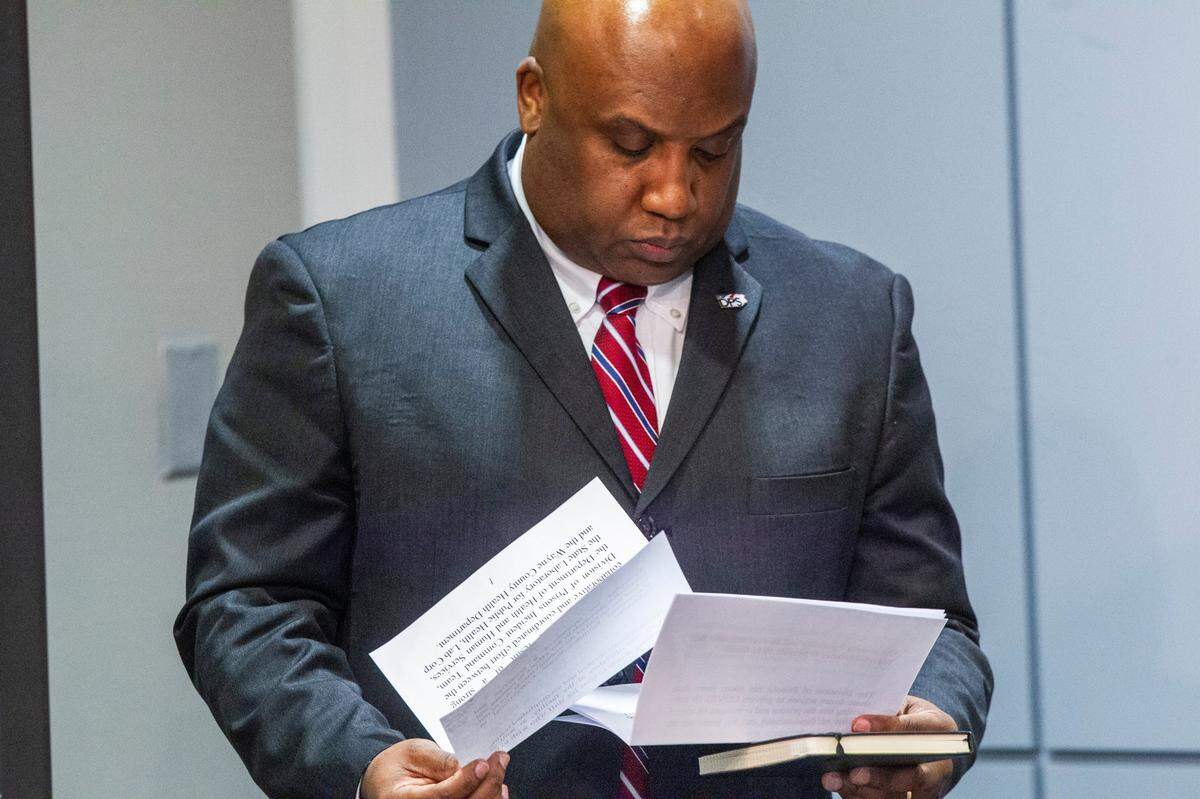 Secretary of the NC Department of Public Safety Erik Hooks&nbsp;looks over his remarks before speaking during a briefing on North Carolinas coronavirus pandemic response a severe weather impacts on the state Friday April 17, 2020 at the NC Emergency Operations Center in Raleigh.