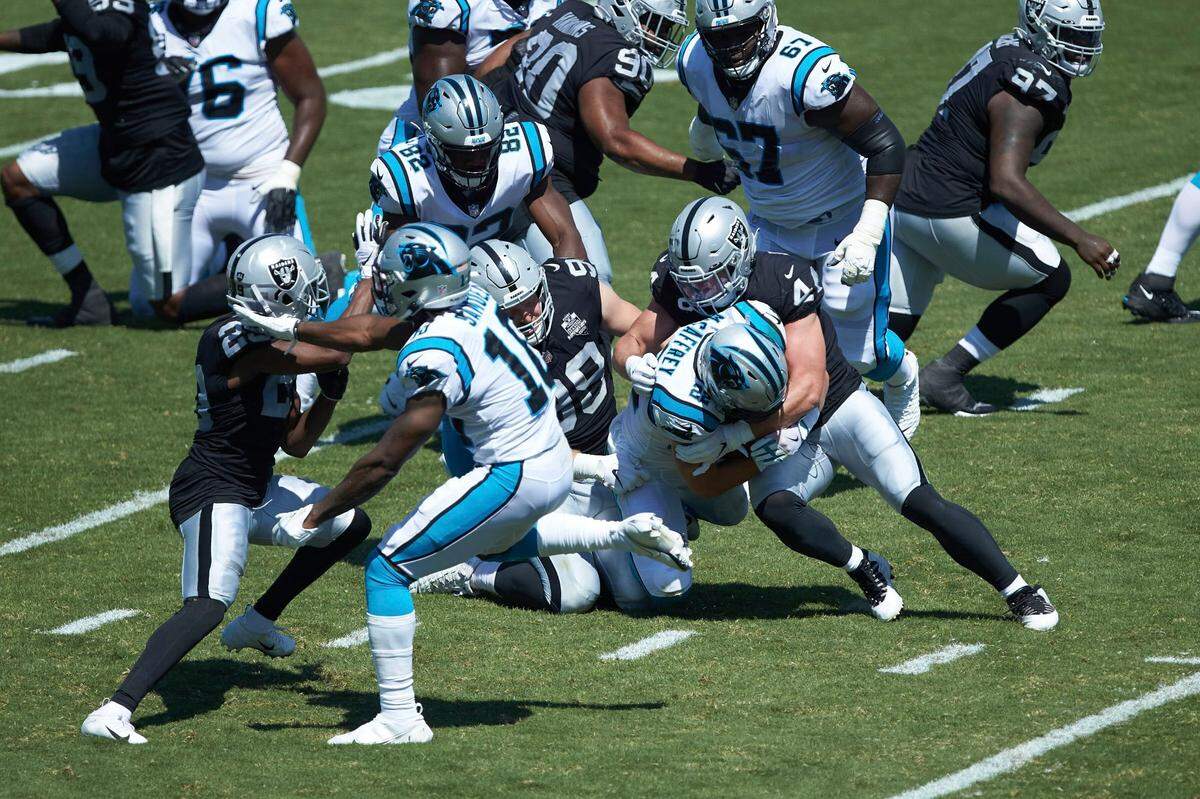 Carolina Panthers running back Christian McCaffrey (22) is tackled by Las Vegas Raiders linebacker Nick Kwiatkoski (44) during first half action of an NFL football game, Sunday, Sept. 13, 2020, in Charlotte, N.C. (AP Photo/Brian Westerholt)